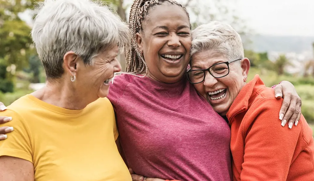 3 people hugging each other