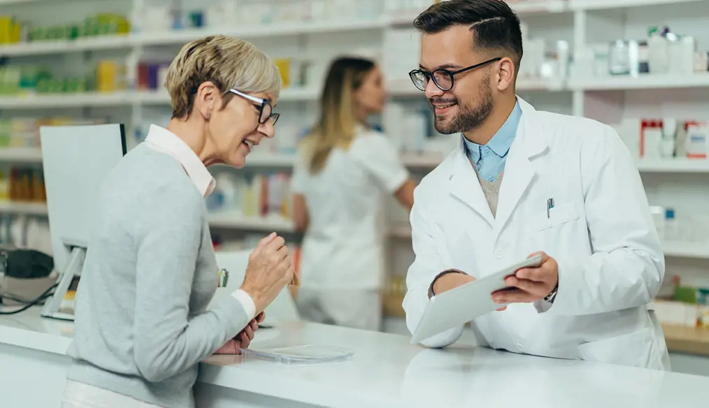 Woman speaking with a pharmacist