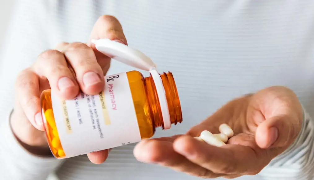 closeup of pills and bottle