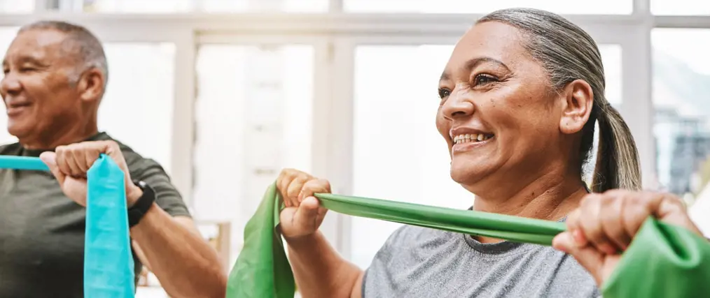 smiling older woman exercising