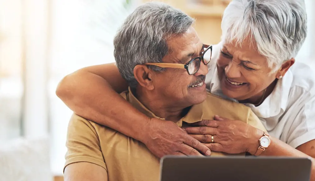 Couple hugging and smiling